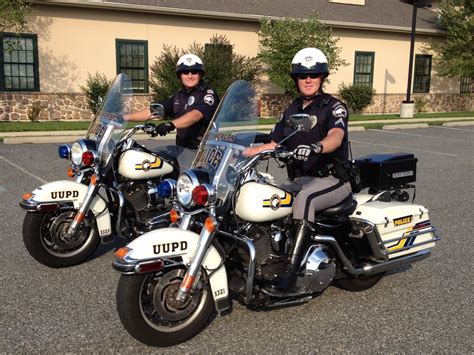 Security guard and police officers on motorbicycles .